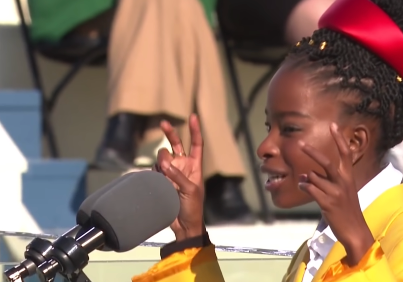 Poet Amanda Gorman delivering the inauguration poem on Jan 20, 2021. Screen-capture via PBS NewsHours YouTube clip.